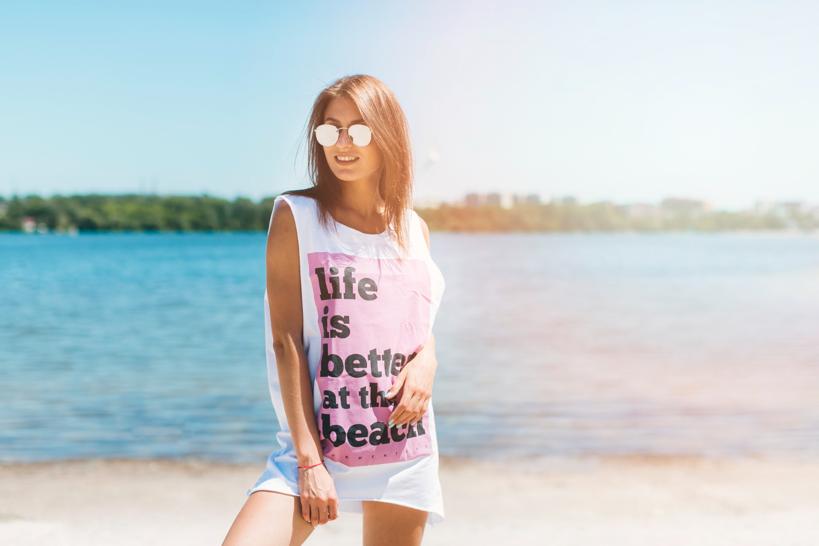 Woman wearing a printed t-shirt at the beach