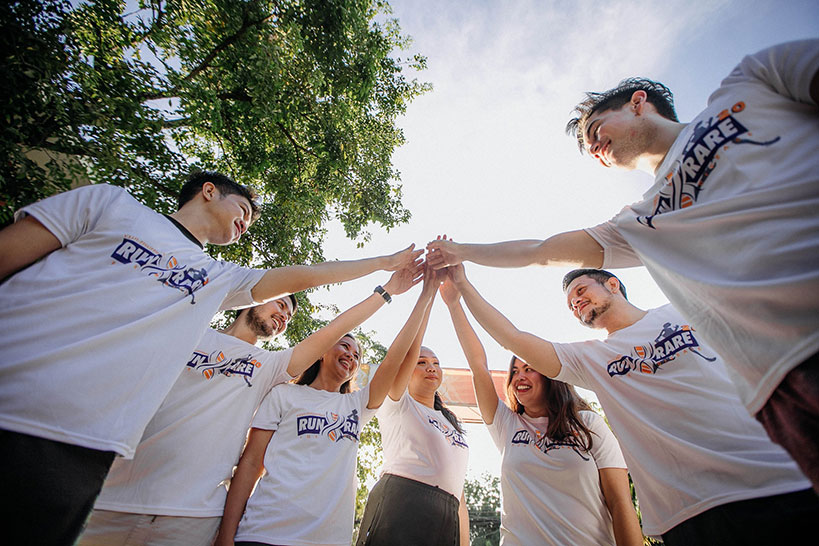 Staff engaging in a team building exercise wearing custom shirts