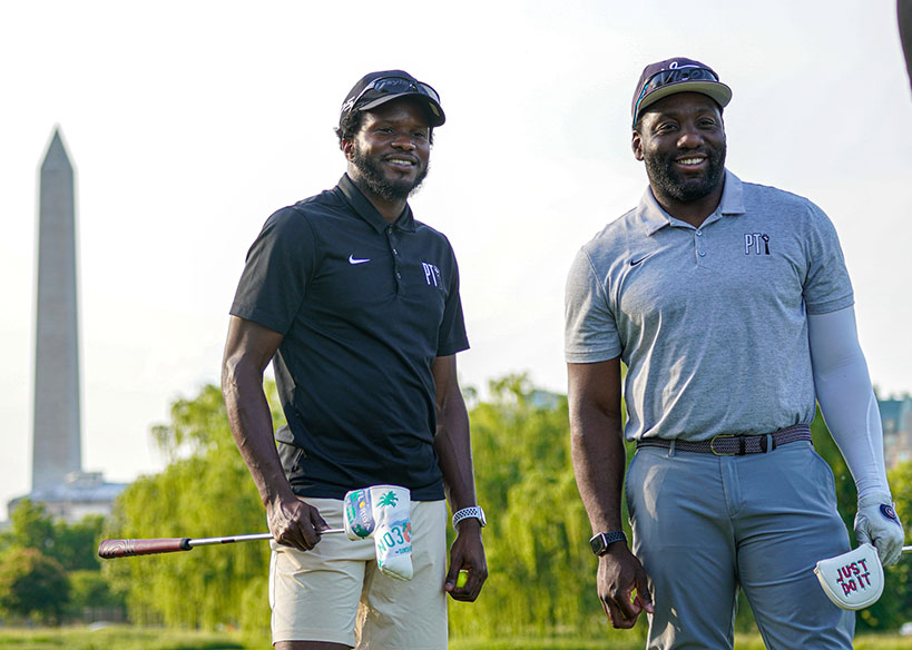 Two golfers in custombranded golf shirts